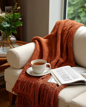 Textiles — the Ember Throw on a sofa