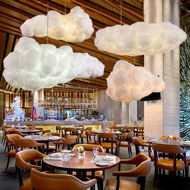 White cloud pendant light hanging over a dining table