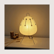 Paper lantern table lamp — standardized card on warm bone background