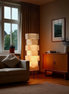 The Yuki stacked lamp in a living room corner, late afternoon sun