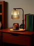 The Ember Lamp candle warmer on a bookshelf