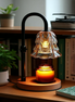 The Petal Lamp candle warmer on a bookshelf ledge