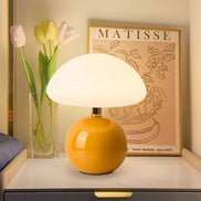 Bloom glass mushroom table lamp in butter yellow, glowing warm
