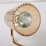 Ember candle warmer lamp in a cozy bedroom setting