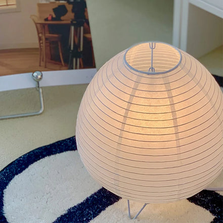 Close-up of the Haru lamp's hand-folded rice paper shade and wire frame
