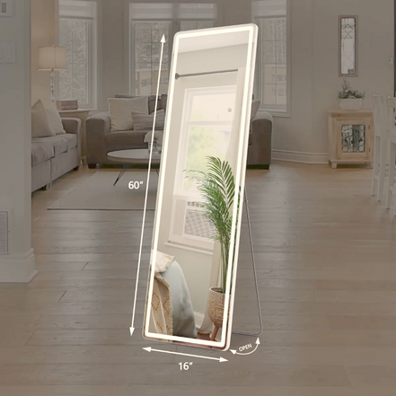 Full-length LED mirror standing in a neutral living room by a window