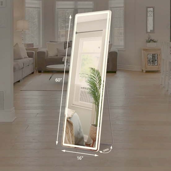 Full-length LED mirror standing in a neutral living room by a window
