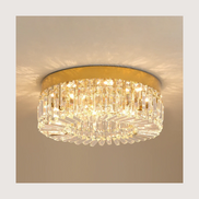 Lucent crystal flush mount chandelier lit warm on a ceiling