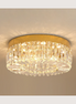 Lucent crystal flush mount chandelier lit warm on a ceiling
