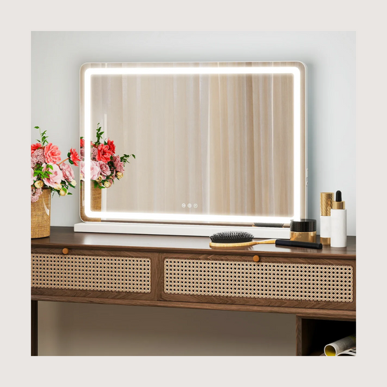 LED vanity mirror on a walnut console with warm border light